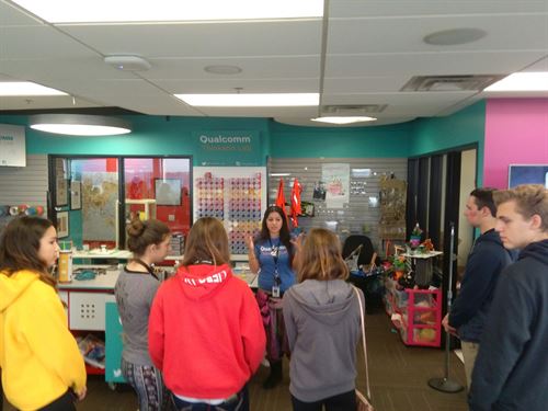 A woman speaking to students